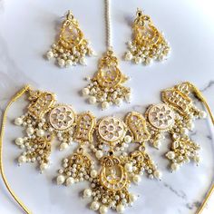 Gorgeous kundan and meenakari bridal set with earrings, teeka and jhoomer. Affordable Meenakari Jewelry For Puja, Gold Bridal Sets With Mirror Work For Festive Occasion, Festive Gold Bridal Set With Mirror Work, Diwali Lehenga With Stone Work, Diwali Gold Kundan Anarkali Set, Bollywood Style White Jewelry Sets For Eid, Diwali Gold Anarkali Set With Kundan, Traditional White Meenakari Sets, Diwali Kundan White Set