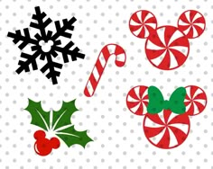 mickey mouse ears and candy canes with snowflakes on the top one is red, green and white