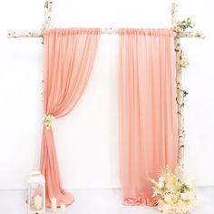 an altar decorated with flowers and candles for a wedding or special occasion in coral pink