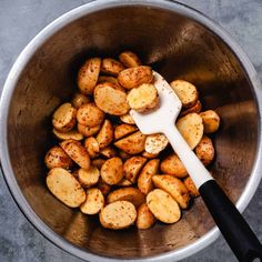 potatoes in a bowl with a spatula