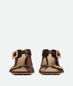 "Find BOTTEGA VENETA Stretch Buckle Mule Sandal on Editorialist. Leather mule sandals. Lining: Lambskin. Color: Fondant. Hardware: Gold finish. Heel: 9 cm | 3.5\". Calfskin." How To Stretch Shoes, Women's Shoes Accessories, Leather Denim, Mule Sandals, Eyewear Womens, Designer Sandals, Leather Mules, Flat Boots, Sunglasses Shop