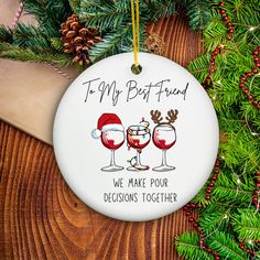 a christmas ornament with two glasses of wine and the words to my best friend