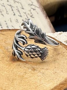 Beautifully detailed thistle ring sure to make a statement! ✦Sterling silver adjustable ring.  **PLEASE NOTE: THIS LISTING IS ONLY FOR ONE RING. ** UNLESS CHOOSEN AS A SET** **Add only earrings available with the link below.** https://daintyshack.etsy.com/listing/1788457645/thistle-earrings-scottish-thistle As with all adjustable rings we recommend adjusting this ring to the correct size and then leaving it alone. Excessive opening and closing can weaken the band and create cracks and possible b Lotus Flower Engagement Ring, Thistle Jewellery, Thistle Earrings, Thistle Ring, Scottish Thistle, Flower Engagement Ring, Symbolic Jewelry, One Ring, Nature Jewelry