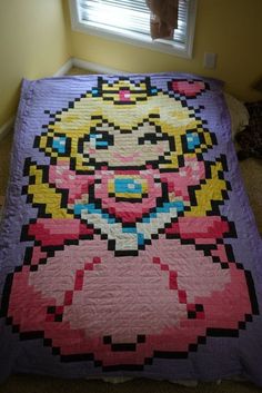 the bed is made up with an image of princess peach from mario kartman