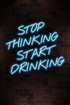 a neon sign that says stop thinking start drinking