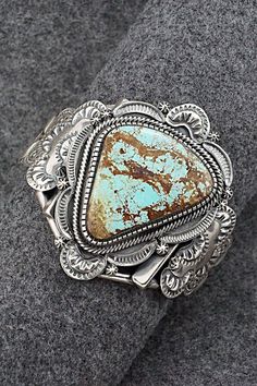 This substantial and beautiful Number 8 turquoise and sterling silver bracelet was made by Navajo silversmith Hank Vandever. The inside of the cuff is signed HV and stamped sterling.Size: 5 1/4" (will fit up to a 6 1/4" wrist)Gap: 1"Width: 2 3/8"Cuff Width: 5/8"Free shipping on all orders! We ship with USPS and always include tracking. All orders ship within a day of payment.Returns are accepted up to 30 days after you receive your order. Just send us a message. Our shop offers cash back or stor Silver Western Cuff Bracelet With Patina, Western Silver Bracelet With Patina, Collectible Western Style Bangle, Number 8, Sterling Silver Bracelet, Native American Jewelry, Turquoise Sterling Silver, Sterling Silver Bracelets, Silver Bracelet