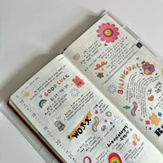 an open planner book with stickers on it