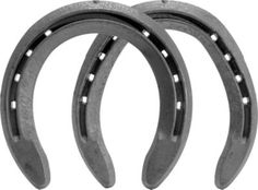 two metal horseshoes are shown on a white background