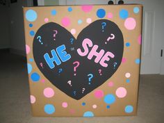 a cardboard box with a heart and question marks on it