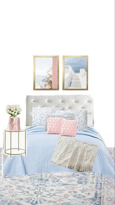 a white bed with blue and pink comforter next to two pictures on the wall