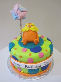 a birthday cake decorated with an image of the lorax holding a lorax stick