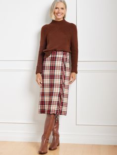 A wrap-inspired silhouette defines our A-line style skirt. In a timeless plaid pattern with playful fringe detail at the front. So chic and flattering. Features A-Line Hits Below Knee Concealed side zip closure Lined Imported Fit: Misses: 26"; Petite: 23 1/2"; Plus: 26" Material: 35% Acrylic, 33% Polyester, 25% Wool, 7% Nylon; Lining: 100% Polyester Care: Dry Clean | Fringe Wrap Skirt - Amazing Plaid Talbots