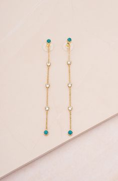 Green opals detail the top and bottom of elegant linear drop earrings plated in high-shine 18-karat gold. 3 1/2" drop Post back 18k-gold plate/cubic zirconia/green opal Imported Green Gems, Green Opal, Opal Earrings, Gold Plated Earrings, Pacsun, Gold Earrings, Cubic Zirconia, 18k Gold, Opal