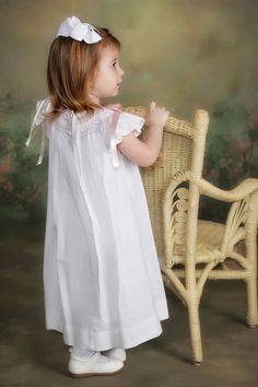 Charming Smocked Toddler Dress 100% cotton bishop hand smocked with bow accents at the shoulders. Beautiful Embroidery and ribbon great birthday, church, Easter Heirloom Flower Girl Dress, Toddler Smock, Smocked Christmas Dresses, Smocked Baby Clothes, Smocked Bishop Dress, Smocking Plates, Smocked Baby Dresses, Easter Flower, Smocking Patterns