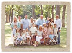 a large family is posing for a photo in the park with their children and grandparents