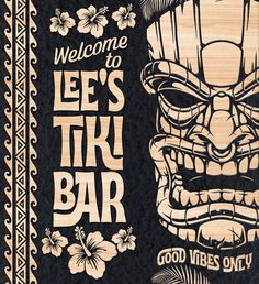 a wooden sign with an image of a tiki