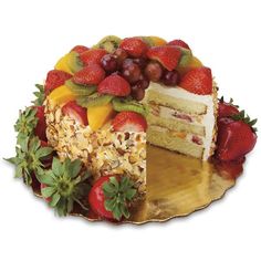 there is a cake with fruit on the top and one slice cut out from it