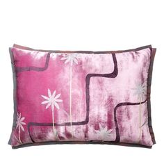 a pink and brown pillow with white flowers on the front, sitting against a white background