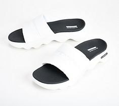 Contoured and cushioned, these slide sandals keep your feet feeling great when you're out and about in the warmer weather. From Skechers. White Slide Slippers For Outdoor Use, White Slide Slippers For Outdoor, White Outdoor Slide Slippers, Breathable Slides For Summer Outdoor Activities, Breathable Casual Slides For Outdoor Activities, Breathable Slides For Outdoor Summer Activities, White Open Toe Flip Flops For Outdoor, Casual Slides For Outdoor Activities In Spring, Casual Slides For Outdoor Spring Activities