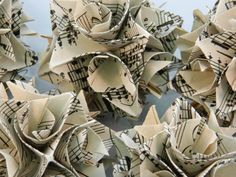 many origami flowers with musical notes on them