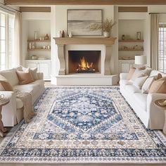 a living room filled with furniture and a fire place in the middle of the room