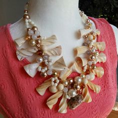 Unique Chunky Beach Shell & Pearl Statement Necklace was created with summer in mind. It's made with these fabulous creamy shell beads, and tons glass pearls and crystals that I have collected and just now was inspired to marry them together. Hidden among the shells is a vintage gold crusted seashell pendant. The clasp is magnetic for easy attachment.More is More is my philosophy! If you want to make a beach statement or someone craving compliments please try this amazing piece. Fabulous Gift BT Statement Collar, Seashell Pendants, Pearl Statement Necklace, Sister Necklace, Shell Beach, Just Now, Summer Necklace, Necklace Unique, Shell Necklace