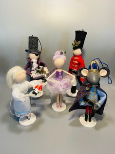 a group of toy figurines sitting next to each other