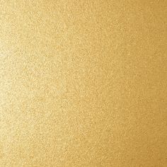 a close up view of a shiny gold surface