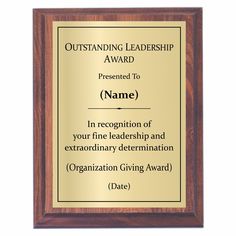 an award plaque with the words outstanding leader, presented to name in recognition and extraordinary determination