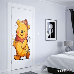 a cartoon winnie the pooh door sticker on a white wall next to a bed