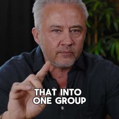 an older man pointing to the side with his finger and saying that into one group