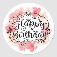 a round sticker with the words happy birthday written in black and pink flowers on it