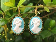 These beautiful Cameo earrings were created with 18x25mm brass scalloped settings adorned with 18x25mm Aqua blue cameo cabochons and brass lever back ear wires. These gorgeous earrings hang beautifully from lever back ear wires and measure 1 3/4 inches in length and 3/4 inches in width. These earrings are very romantic and chic...You will truly enjoy these for many years to come. *All of my listings are handmade with love and ready to ship and will arrive to you in a gift box with bow for easy g Cameo Drop Earrings As Gift, Cameo Drop Earrings Jewelry Gift, Gift Cameo Drop Earrings Jewelry, Turquoise Clip-on Earrings As Gift, Cameo Drop Earrings For Gifts, Blue Cameo Jewelry Gift, Turquoise Dangle Clip-on Earrings For Gift, Turquoise Dangle Clip-on Earrings As Gift, Victorian Earrings