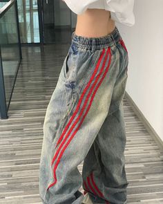 These wide-leg jeans feature a vintage washed denim design with bold red side stripes, creating a unique 90's style look Size:• S: Waist: 64cm/ 25.2 in, Hips: 106cm/ 41.7 in, Length: 101cm/ 39.8 in• M: Waist: 68cm/ 26.8 in, Hips: 110cm/ 43.3 in, Length: 102cm/ 40.2 in• L: Waist: 72cm/ 28.3 in, Hips: 114cm/ 44.9 in, Length: 103cm/ 40.6 in• XL: Waist: 77cm/ 30.3 in, Hips: 119cm/ 46.9 in, Length: 104cm/ 40.9 in• 2XL: Waist: 82cm/ 32.3 in, Hips: 124cm/ 48.8 in, Length: 105cm/ 41.3 in• 3XL: Waist: 87cm/ 34.3 in, Hips: 129cm/ 50.8 in, Length: 105cm/ 41.3 in• 4XL: Waist: 92cm/ 36.2 in, Hips: 134cm/ 52.8 in, Length: 105cm/ 41.3 inMaterial: Denim Girls Streetwear, Street Aesthetic, Y2k Girls, Jeans Trend, Street Jeans, Retro Jeans, Streetwear Jeans, Oversized Jeans, Xmas List