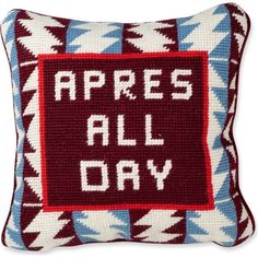 a red and blue pillow with the words appress all day on it