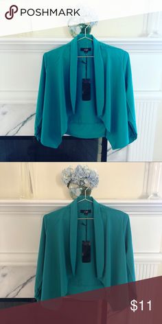 Asymmetrical jacket 🧥 Teal ish Green Asymmetrical Jacket 🧥 Brand new iris Jackets & Coats Blazers Formal Spring Cape Outerwear, Formal Cape Outerwear For Spring, Chic Asymmetrical Spring Blazer, Chic Asymmetrical Blazer For Spring, Fitted Cape Outerwear For Work, Fitted Cape For Workwear, Chic Spring Cape Outerwear, Asymmetrical Spring Office Blazer, Spring Office Asymmetrical Blazer