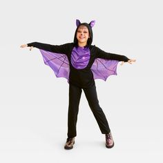 Your child will be ready to unleash their nocturnal side wearing this Midnight Bat Halloween Costume Jumpsuit with Wings from Hyde & EEK! Boutique™. Made from polyester, this kids' long-sleeve jumpsuit is fashioned in a solid black hue with a shimmering purple front. It includes purple wings and an attached hood with coordinating ears to transform your kiddo into a creepy-cute creature of the night. Instantly elevating their Halloween experience, this full-length jumpsuit is perfect for trick-or Kids Bat Costume, Creepy Cute Outfits, Astronaut Halloween Costume, Halloween Costume Jumpsuit, Maleficent Halloween Costume, Bat Halloween Costume, Mummy Halloween Costume, Dragon Halloween Costume, Maleficent Halloween