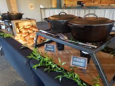 there are many different types of food on the table at this event, including bread and rolls