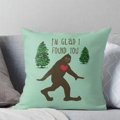 i'm glad i found you sasquat throw pillow on couch with pillows