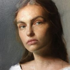 a painting of a woman's face with long hair and blue eyes, wearing a white shirt