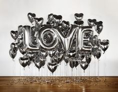 the word love made out of silver balloons