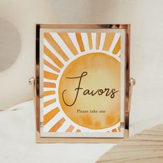 an orange and white business card holder with the word favors written on it in cursive writing