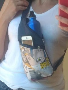 a woman holding a cell phone and wearing a fanny bag with an ipod in it