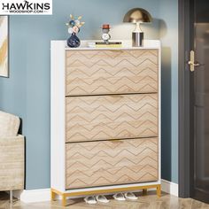 a wooden dresser with two drawers in a room