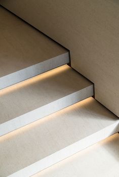 some steps with lights on them in a room