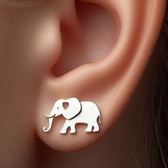 Width: 12mm  Discover the enchantment of the savanna with these exquisite Elephant Earrings! 🐘✨ Each piece is a tribute to these majestic creatures, symbolizing strength and wisdom. Whether you're a wildlife enthusiast or adore unique jewelry, these earrings are a perfect choice. Crafted with precision, they're available in sterling silver, solid 14k yellow gold, rose gold, or white gold, ensuring there's a style to suit every preference. The elegant design captures the essence of the elephant Majestic Creatures, Silver Elephant, Gold Elephant, Elephant Earrings, Silver Elephants, African Wildlife, Earrings Unique, African Safari, Elephant Gifts