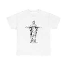 a white t - shirt with the statue of christ on it's chest and arms outstretched