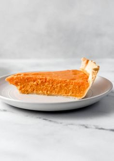 a piece of pie sitting on top of a white plate