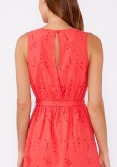 Add a pop of color to your boho wardrobe with this stunning coral midi dress. It features intricate embroidered eyelet details throughout and a tiered skirt for a relaxed fit. The V-neckline and adjustable tie waist belt offer a flattering silhouette, while the back keyhole with button closure adds a touch of charm. Sleeveless and fully lined, it's perfect for warm-weather adventures. Embroidered eyelet Relaxed fit Sleeveless Mid-length Tiered skirt V-neckline Adjustable tie waist belt Back keyh Spring Beach Eyelet Dresses, Spring Beach Dresses With Eyelet Details, Coral Dresses For Spring Vacation, Spring Vacation Coral Dresses, Spring Coral Vacation Dresses, Coral Spring Vacation Dresses, Coral Dress For Spring Brunch, Bohemian Eyelet Dress For Summer, Sleeveless Eyelet Midi Dress For Spring