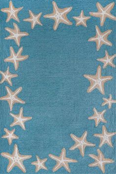 a blue area rug with white stars on the top and bottom, in front of a light blue background